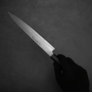 Hand holding the Hideo Kitaoka damascus shirogami#2 yanagiba 270mm