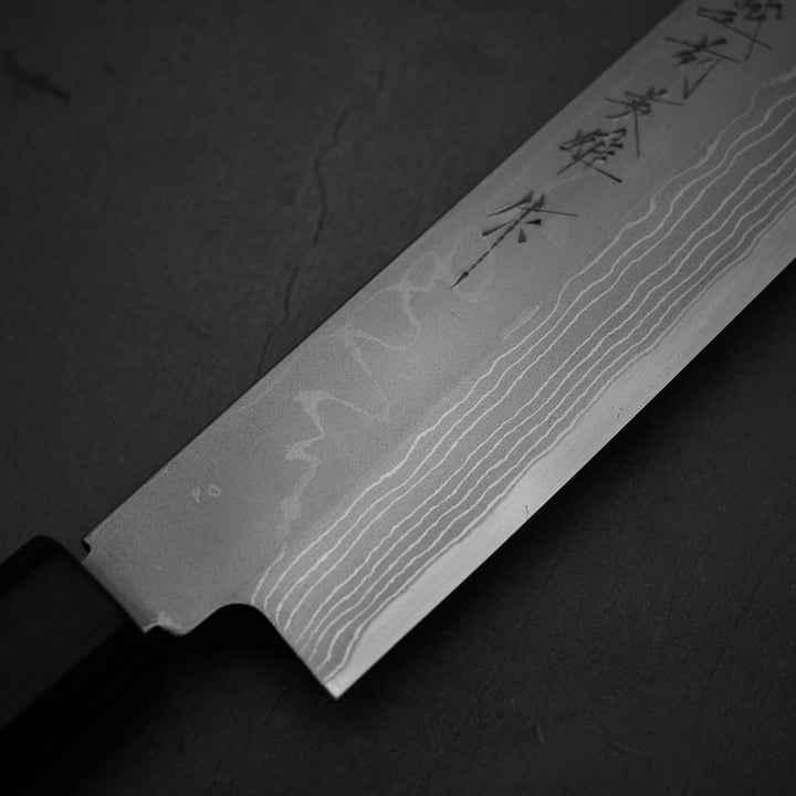 Close up view around the heel of Hideo Kitaoka damascus shirogami#2 yanagiba 270mm