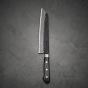 Top view of Ittosai Kotetsu tsuchime kurouchi aogami super kiritsuke gyuto showing the back side of the knife