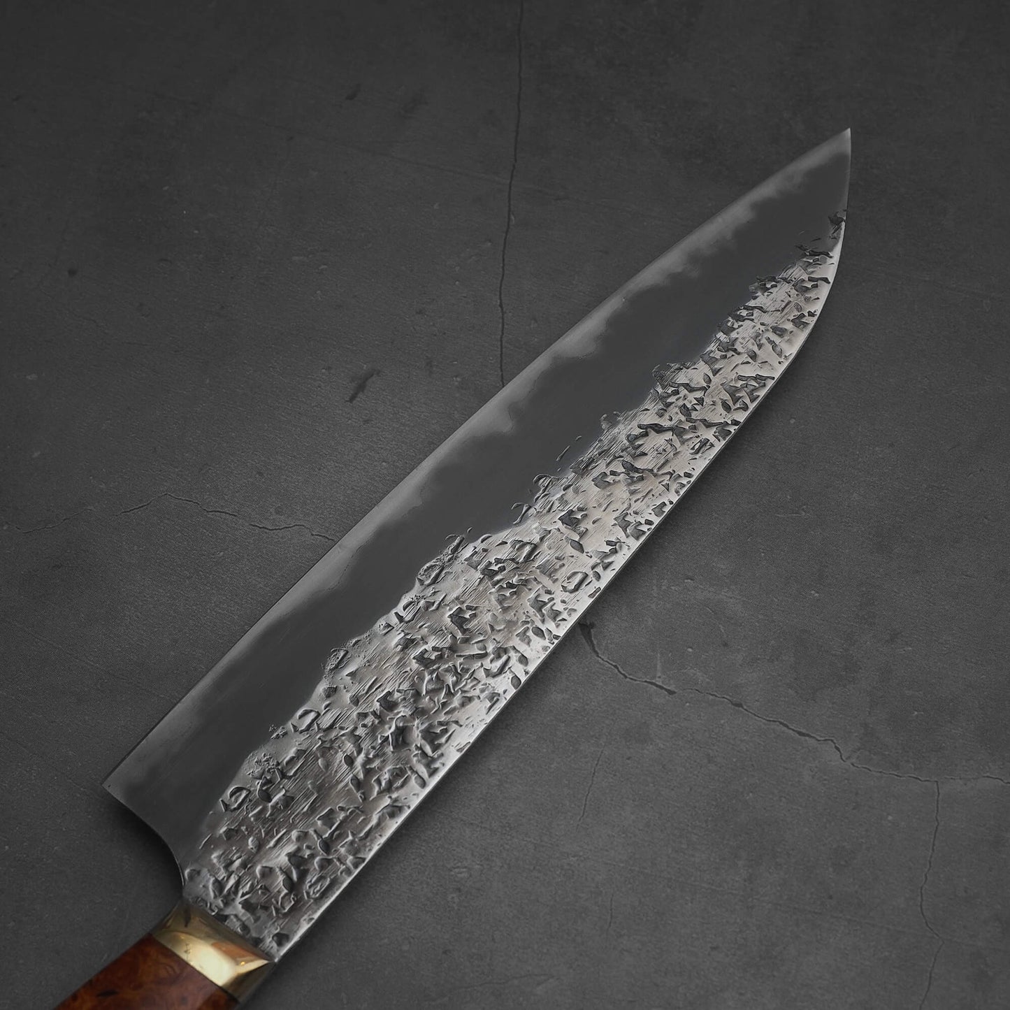 Top view of the left side of 220mm Kisuke Manaka tsuchime honwarikomi shirogami#2 gyuto knife