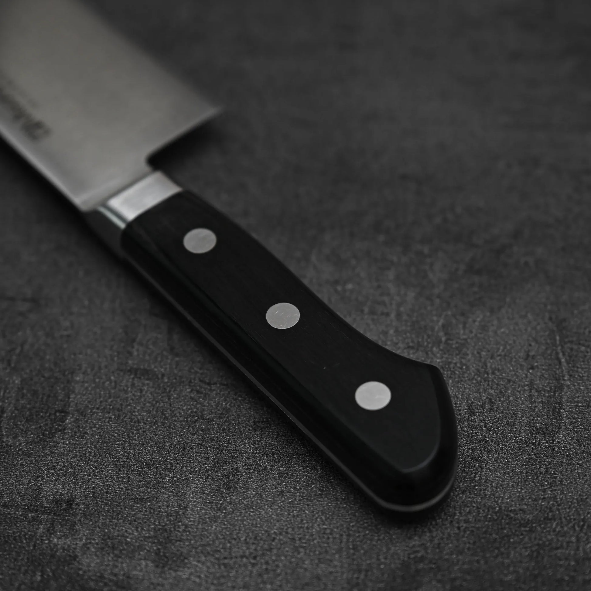 Angled view of the handle of Misono molybdenum steel series gyuto knife 240mm