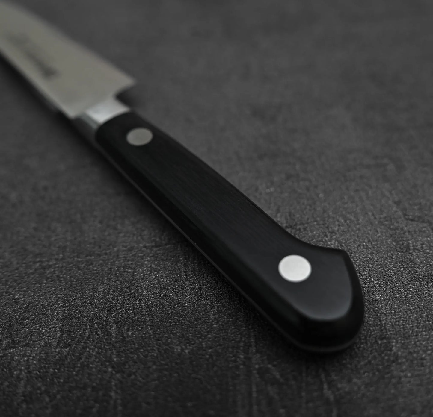 Close up view of the handle of Misono Molybdenum petty knife 120mm