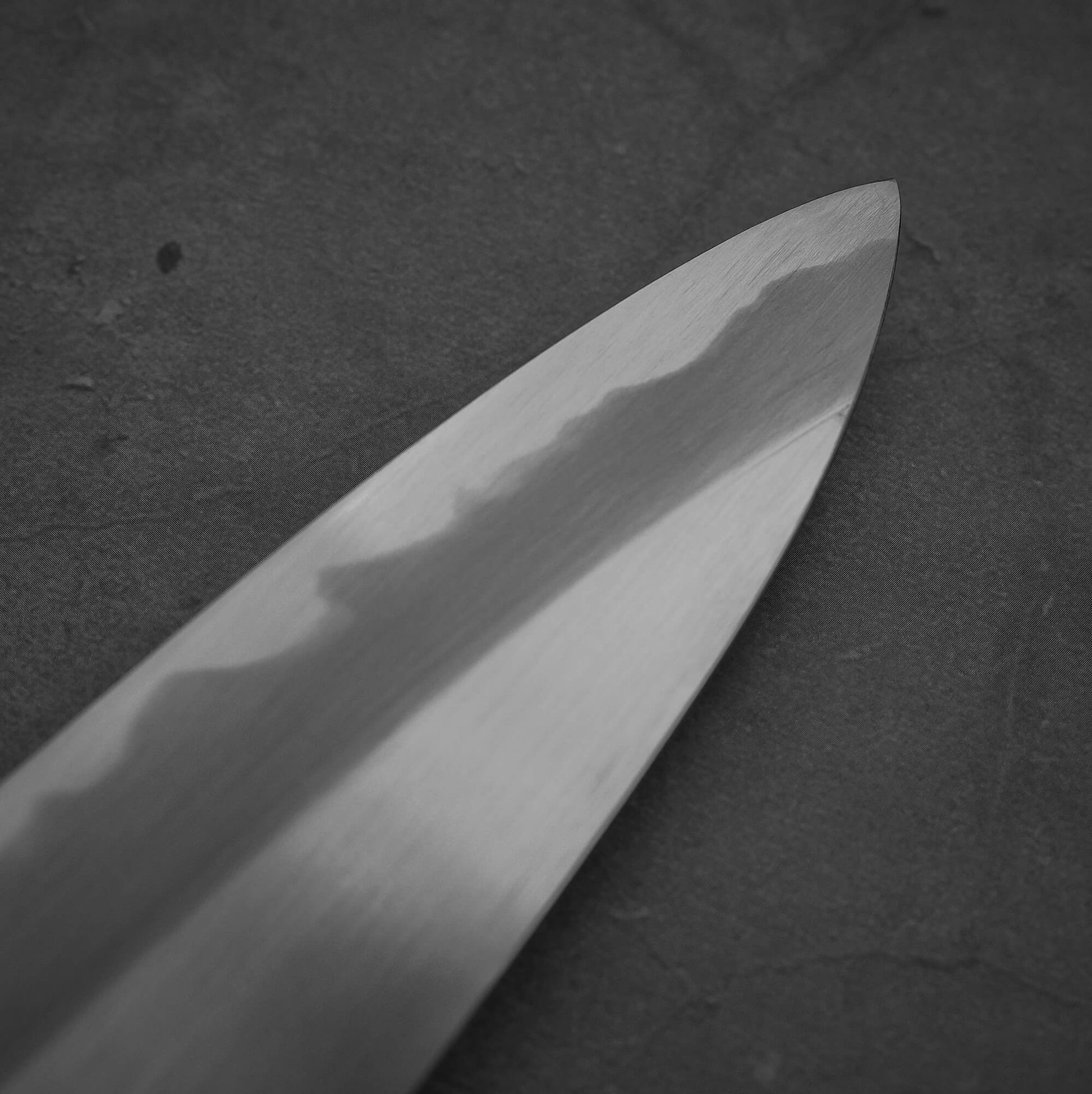 Close up view of the tip area of Nakagawa shinogi aogami#2 gyuto knife