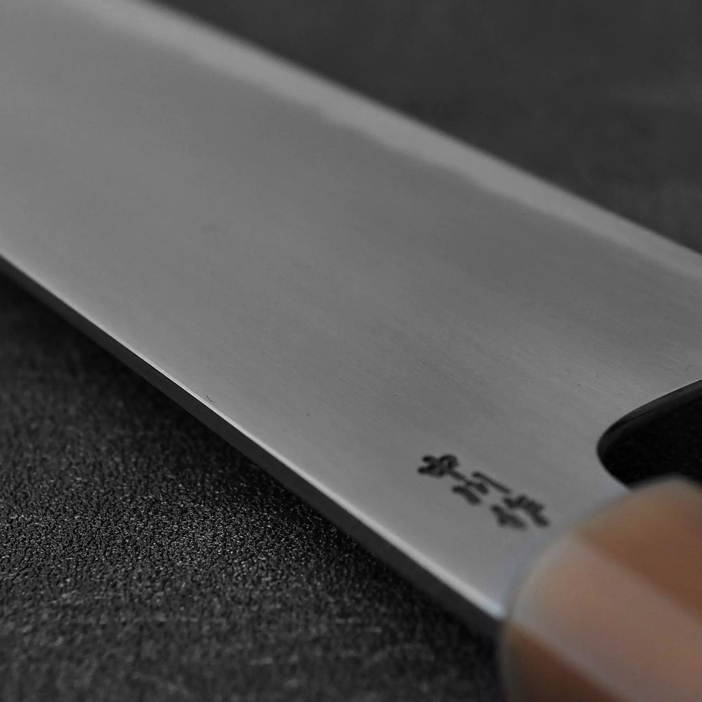 Close up view of the spine of Nakagawa bokashi shirogami#1 tall gyuto knife