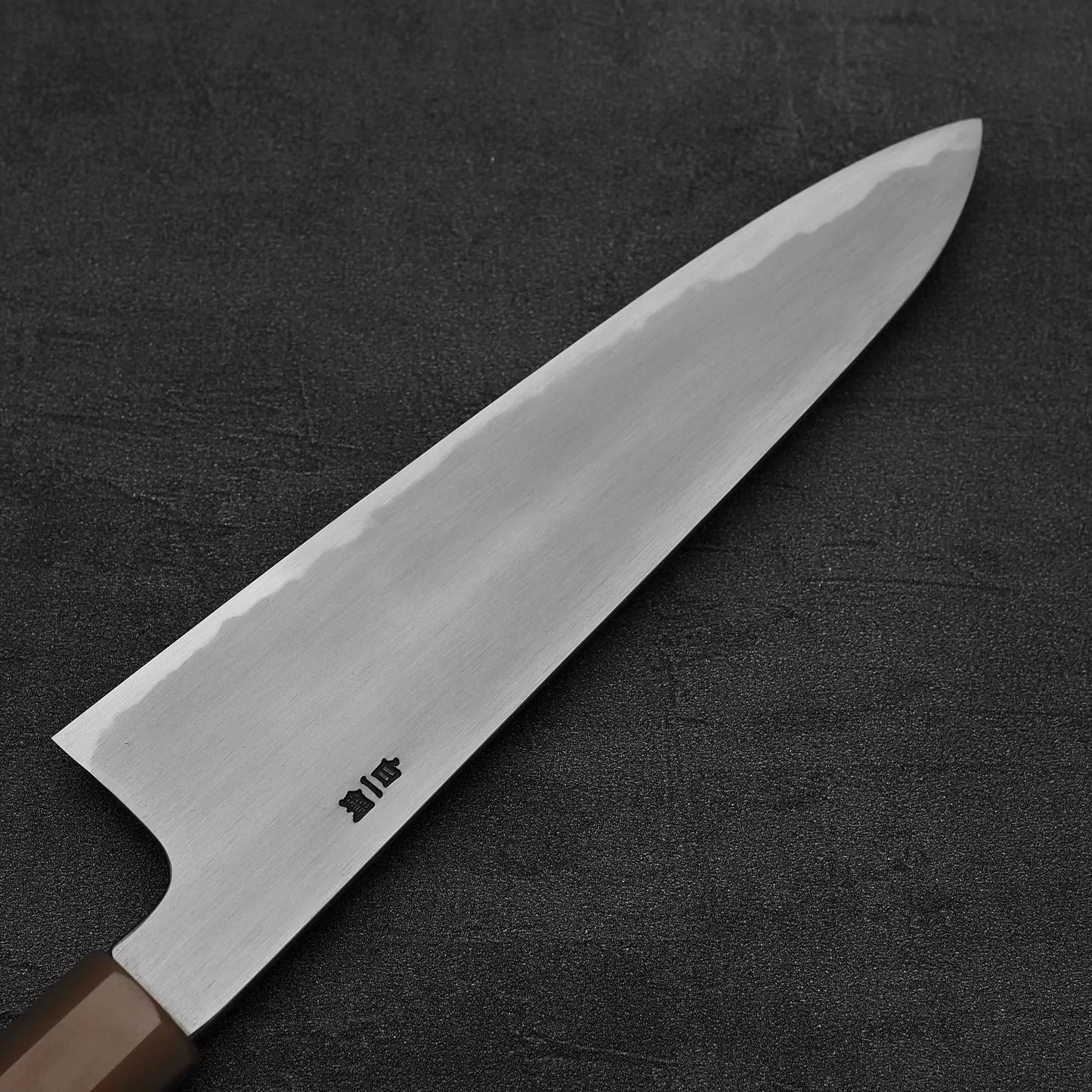 Close up view of the back side of Nakagawa bokashi shirogami#1 tall gyuto knife