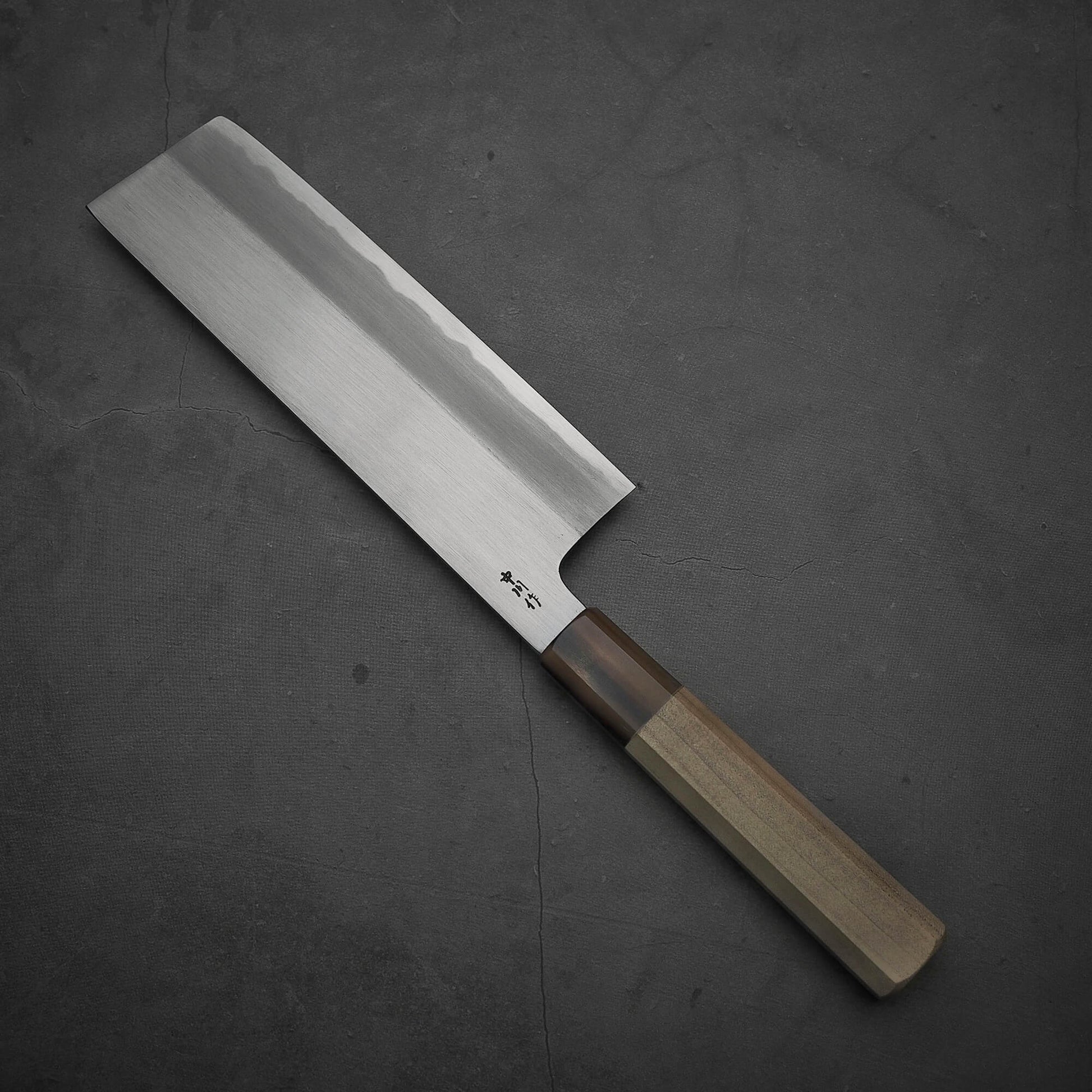 Top view of the Nakagawa shinogi aogami#2 nakiri knife where the tip part is facing towards the upper left