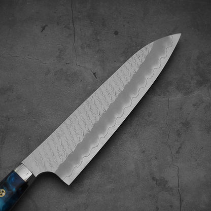 Top view of the blade of 210mm Nigara tsuchime SG2 gyuto knife with blue handle