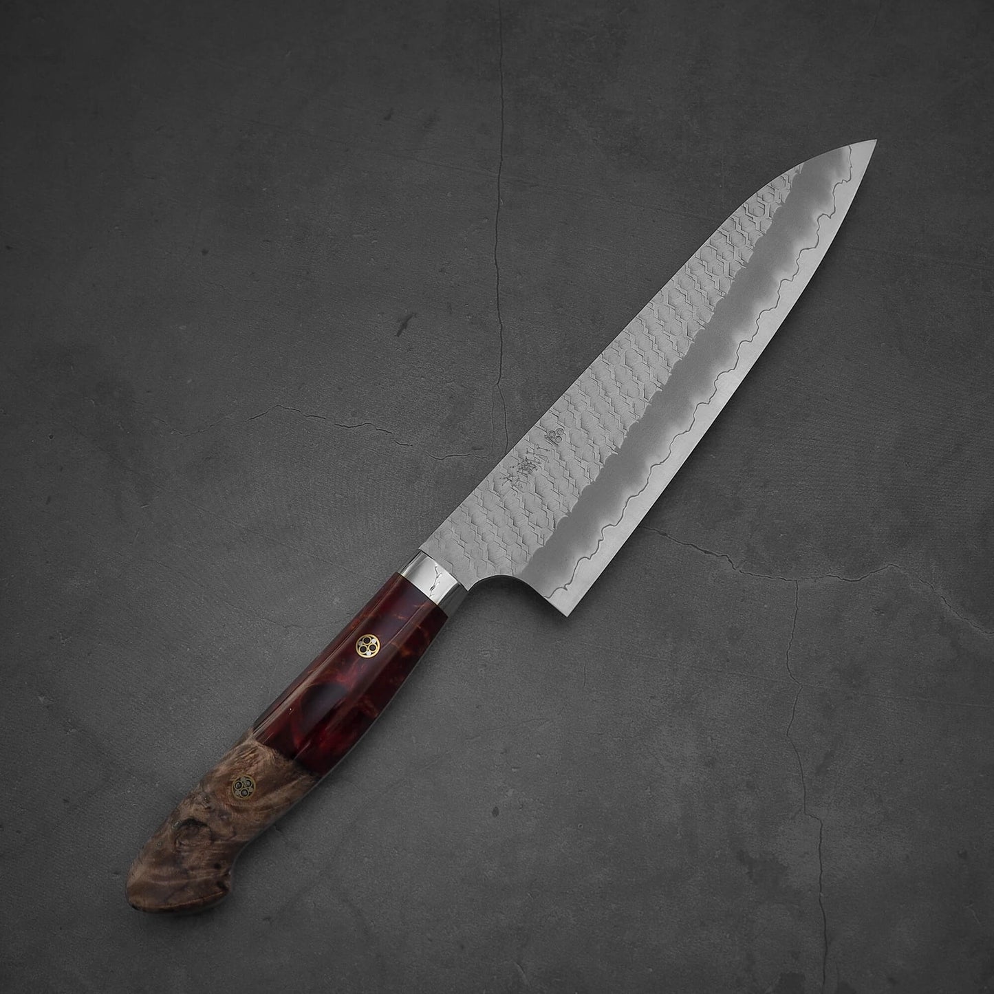 Top view of 210mm Nigara tsuchime SG2 gyuto knife with red handle