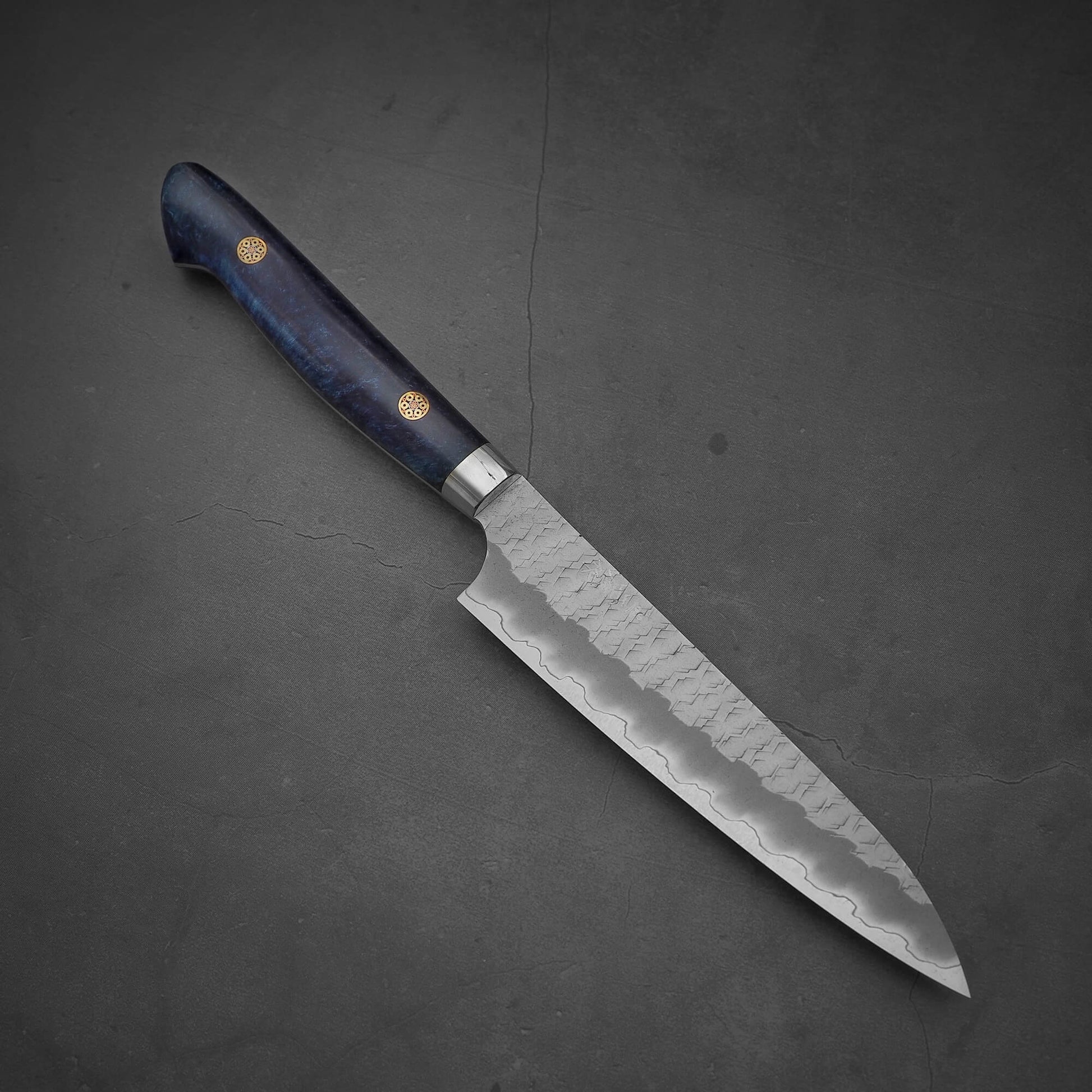 Top view of the Nigara tsuchime SG2 petty knife 150mm in a diagonal position where the tip is facing the bottom right