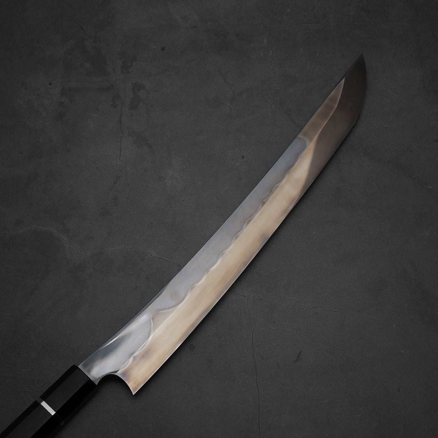 Top view of Nigara shirogami#1 mizuhonyaki sakimaru yanagiba. Image shows the right side of the blade
