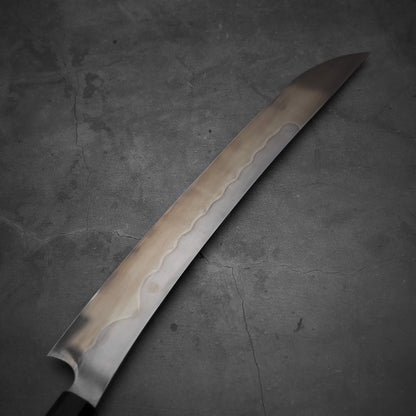 Top view of Nigara shirogami#1 mizuhonyaki sakimaru yanagiba. Image focuses on the left side of the blade