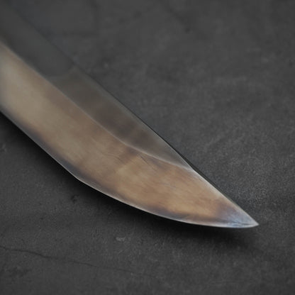 Close up view of Nigara shirogami#1 mizuhonyaki sakimaru yanagiba. Image focuses on the tip of the knife.