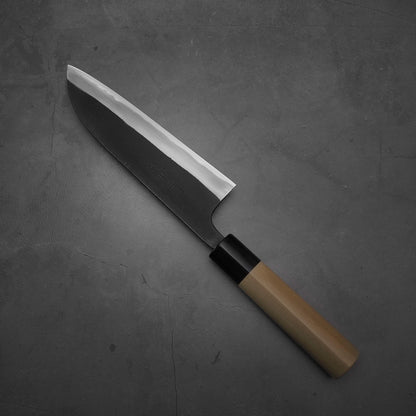 Top view of Shigefusa kurouchi 165mm santoku where the tip faces the upper left
