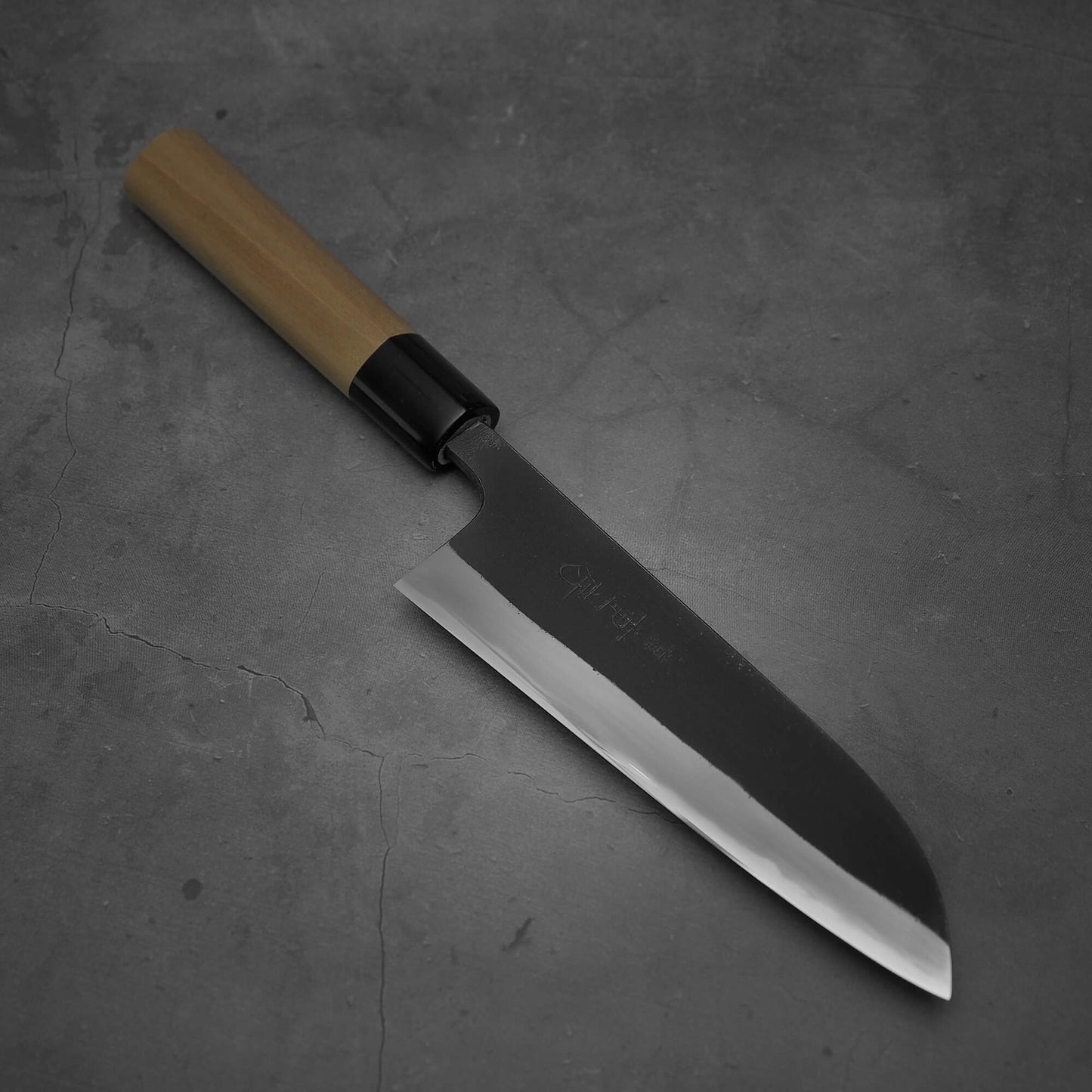 Top view of Shigefusa kurouchi 165mm santoku where the tip faces lower right
