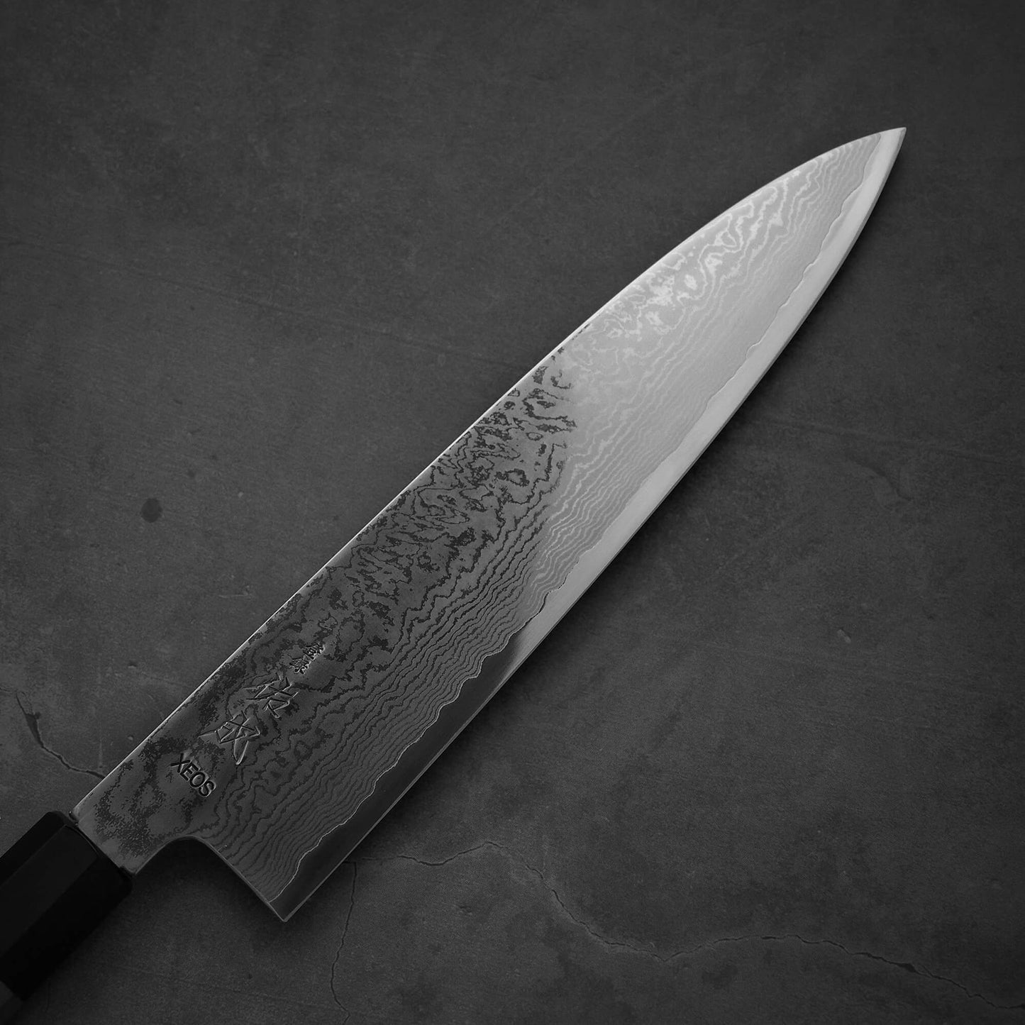 Close up view of the blade of Sukenari damascus XEOS gyuto. Image shows the right side of the blade