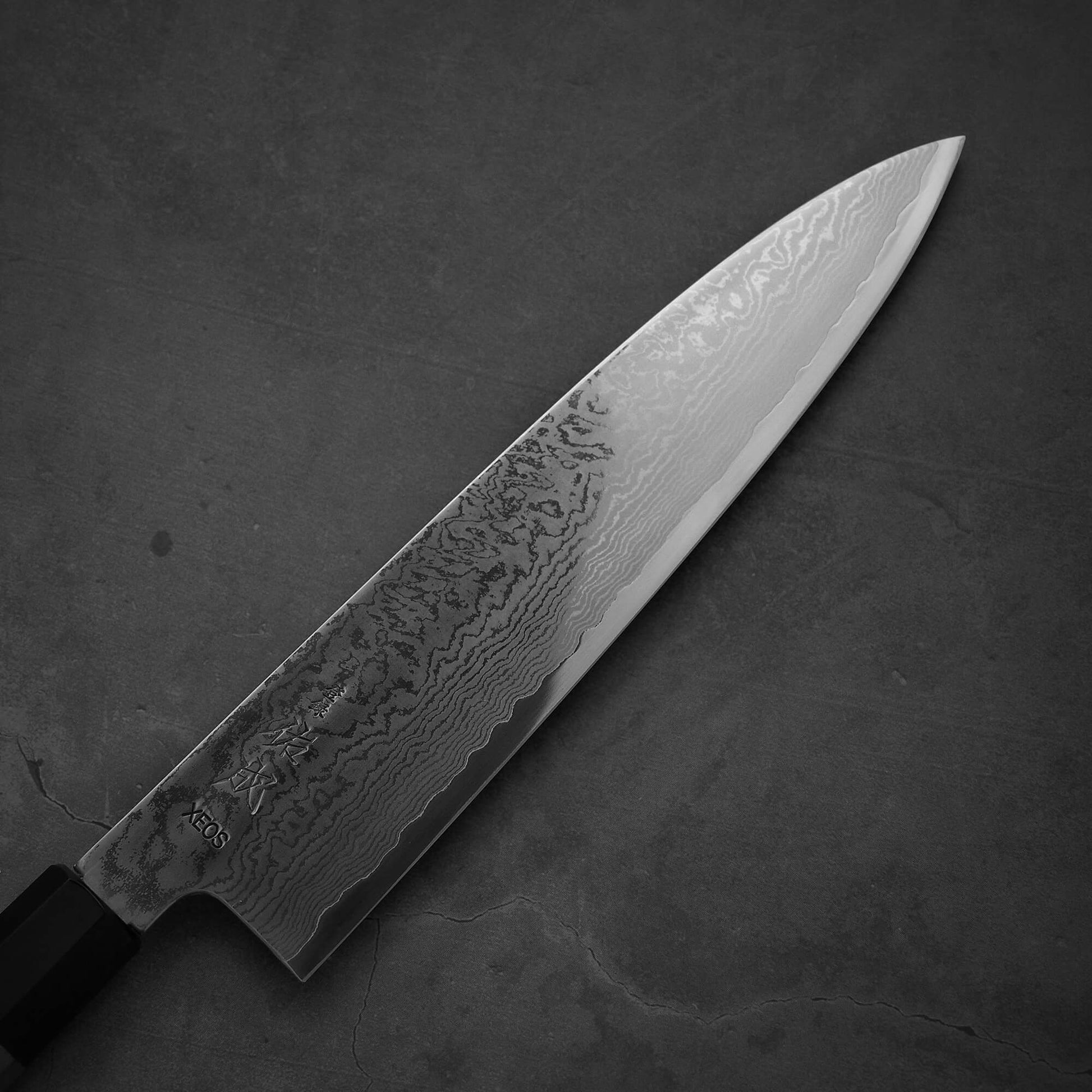 Close up view of the blade of Sukenari damascus XEOS gyuto. Image shows the right side of the blade