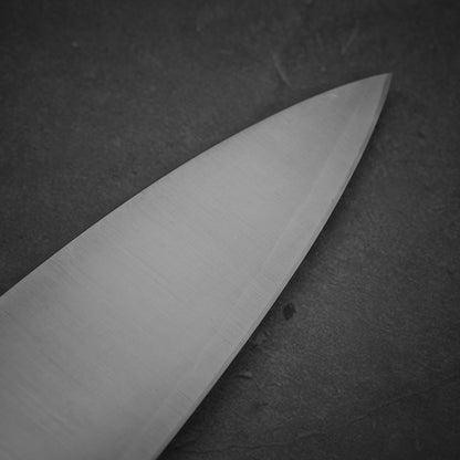 Close up view of the tip area of Sukenari XEOS gyuto 240mm. Image shows right side
