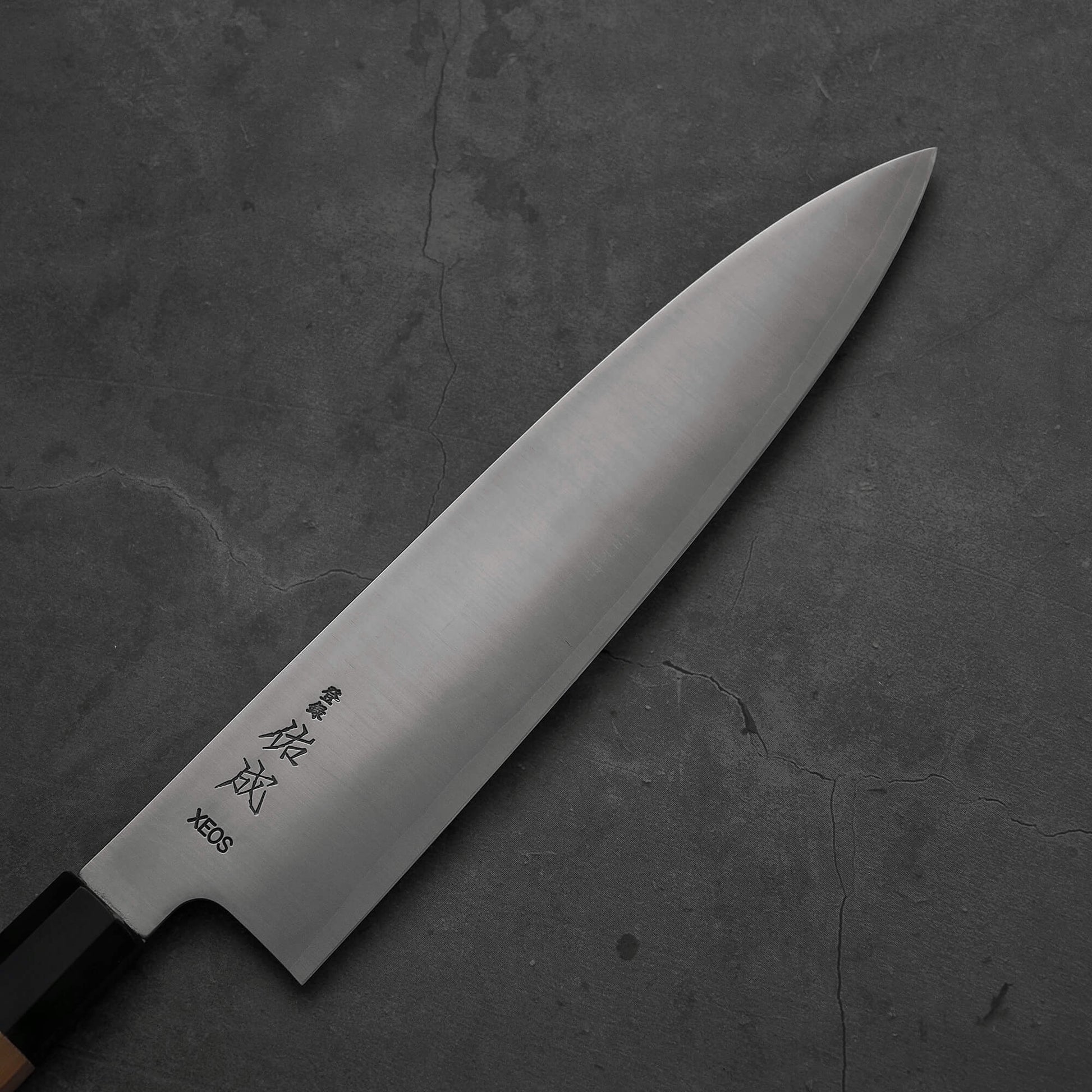 Top view of the blade of Sukenari XEOS gyuto 240mm. Image focuses on the right side