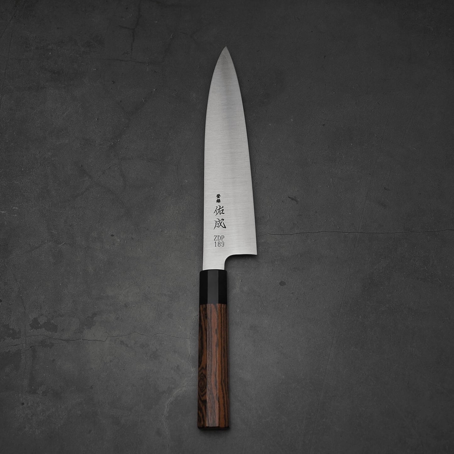 Top view of 210mm Sukenari ZDP189 gyuto knife in vertical position.