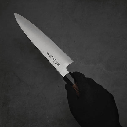 Hand holding a 240mm Sukenari ZDP189 gyuto knife