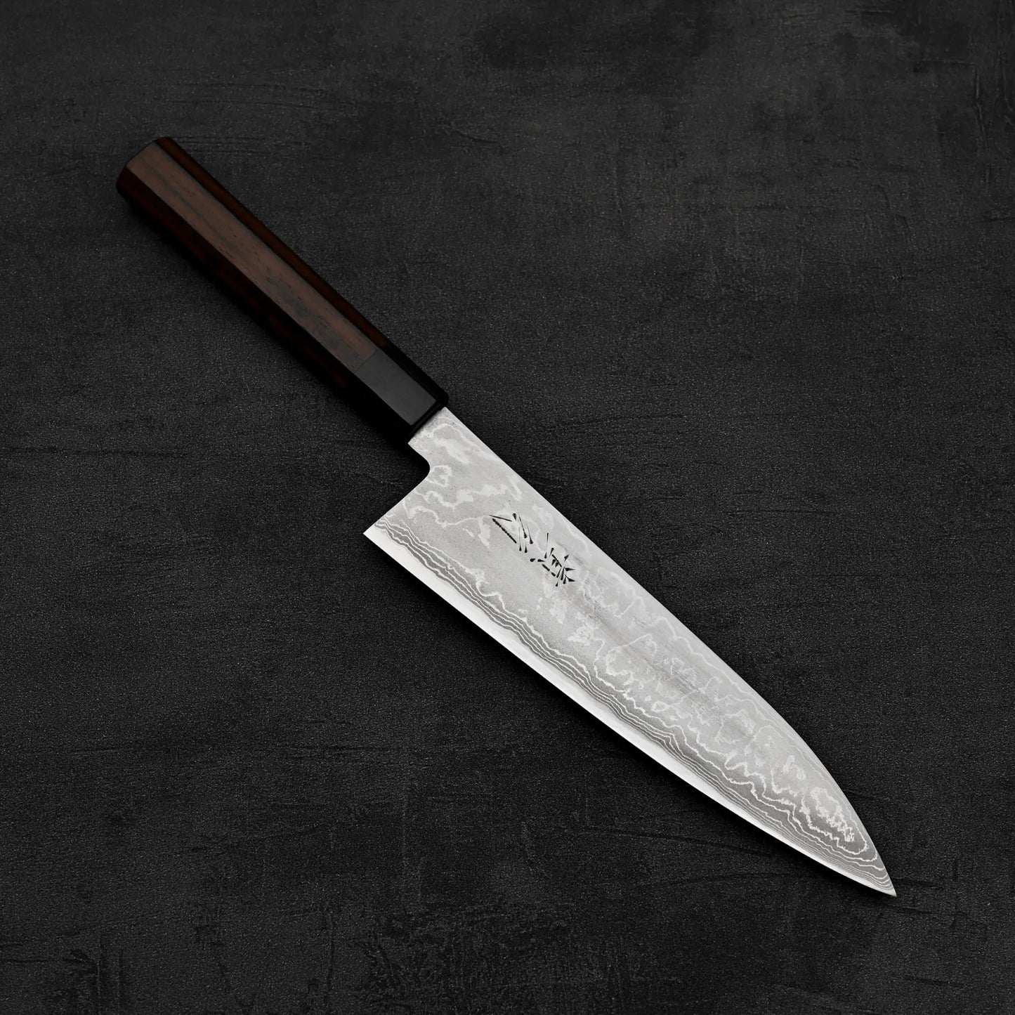Top down view of Takayuki Iwai aogami#2 damascus 210mm gyuto knife in diagonal position