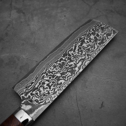 Top view of the blade of Takeshi Saji black damascus SG2 nakiri ironwood. Image shows the left side of the blade