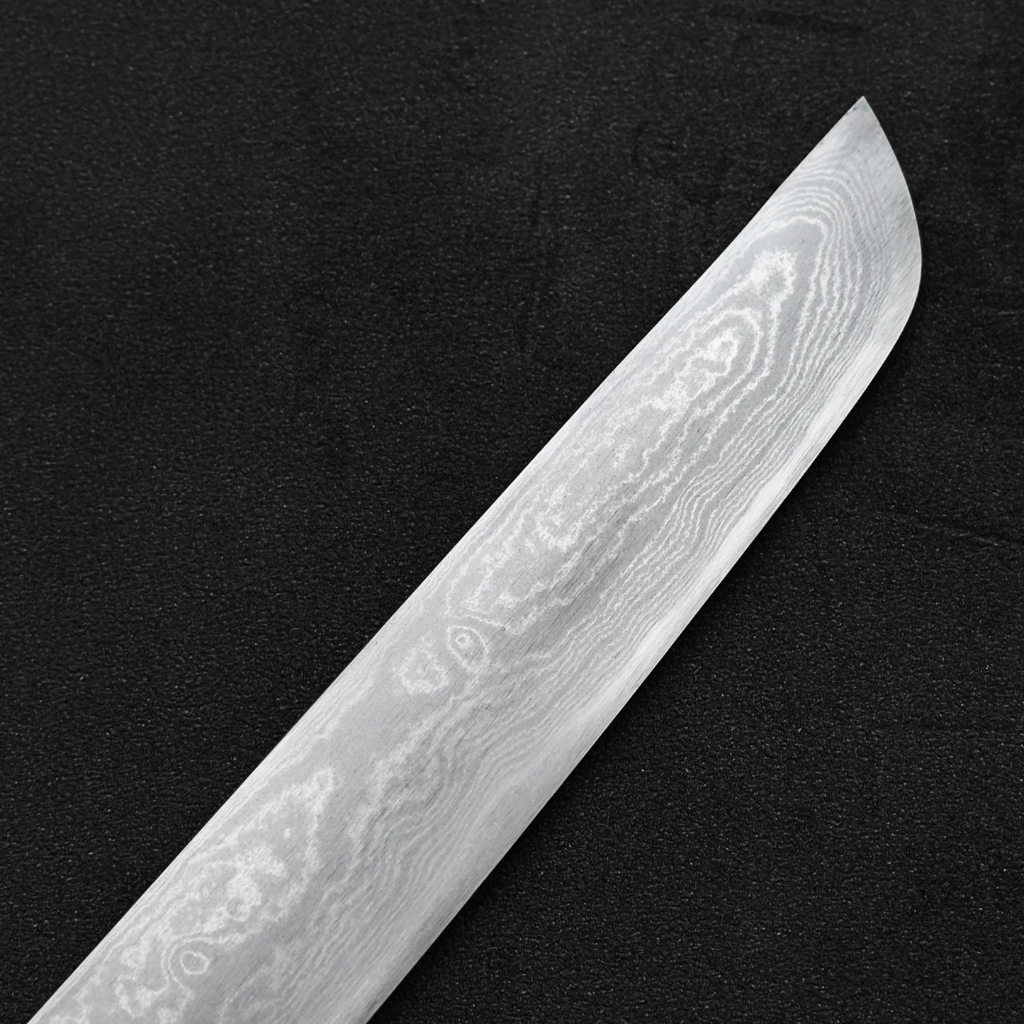 Close up view of the tip area of Yoshikazu Ikeda aogami#1 damascus sakimaru sujihiki knife