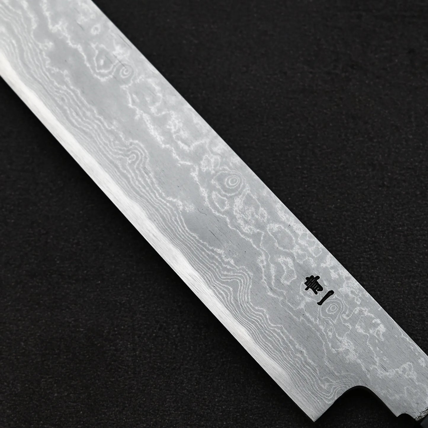 Close up view of the kanji at the back of Yoshikazu Ikeda aogami#1 damascus sakimaru sujihiki knife