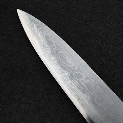 Close up view of the tip area of the back side of Yoshikazu Ikeda aogami#1 damascus slim gyuto knife