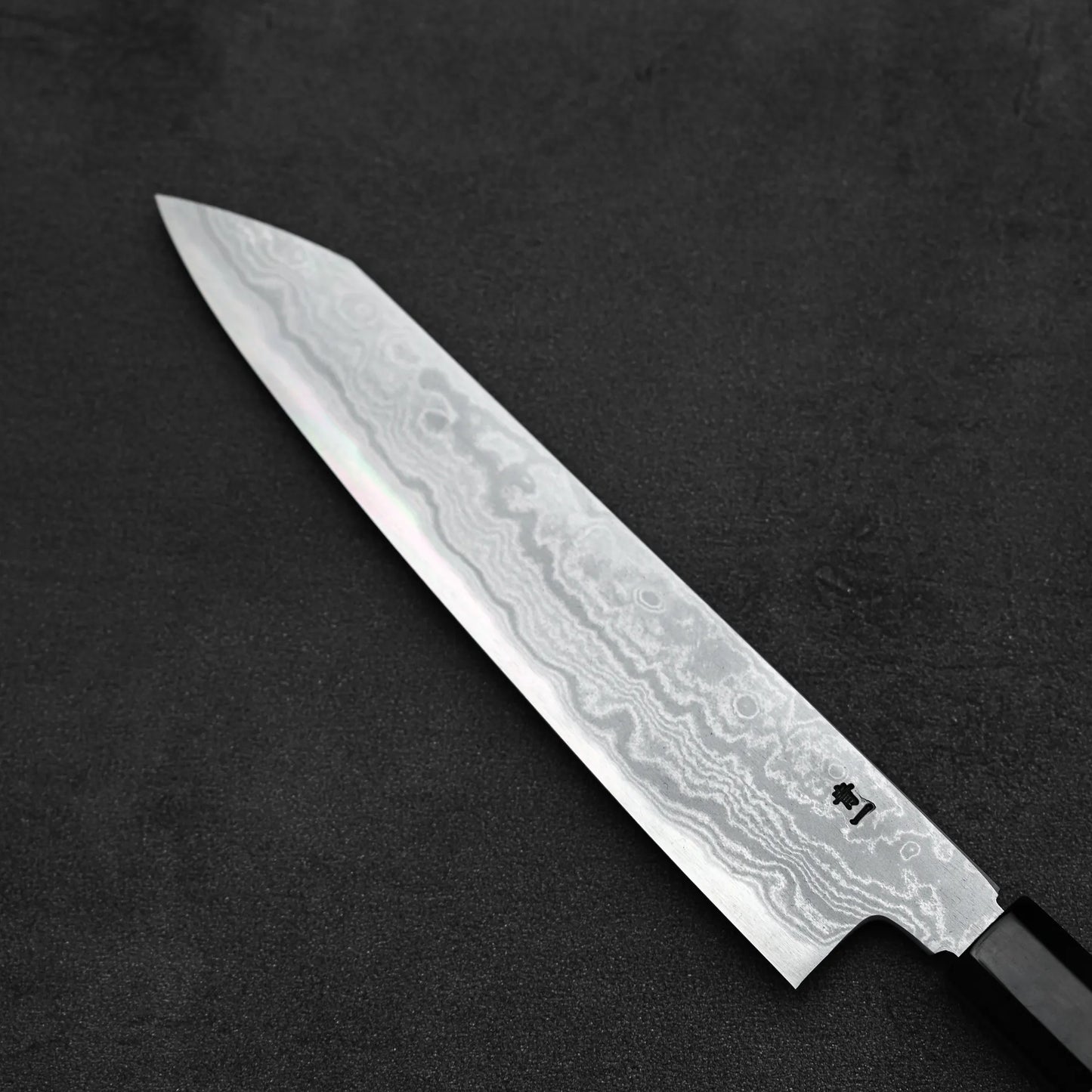 Close up view of the back side of Yoshikazu Ikeda aogami#1 damascus slim ktip gyuto knife