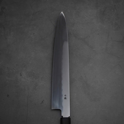 Close up view of the blade of Yoshikazu Ikeda honyaki sujihiki. This hand-forged Japanese knife is made of shirogami#3 steel.