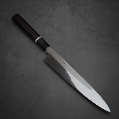 Angled view of Yoshikazu Ikeda honyaki sujihiki. This hand-forged Japanese knife is made of shirogami#3 steel.
