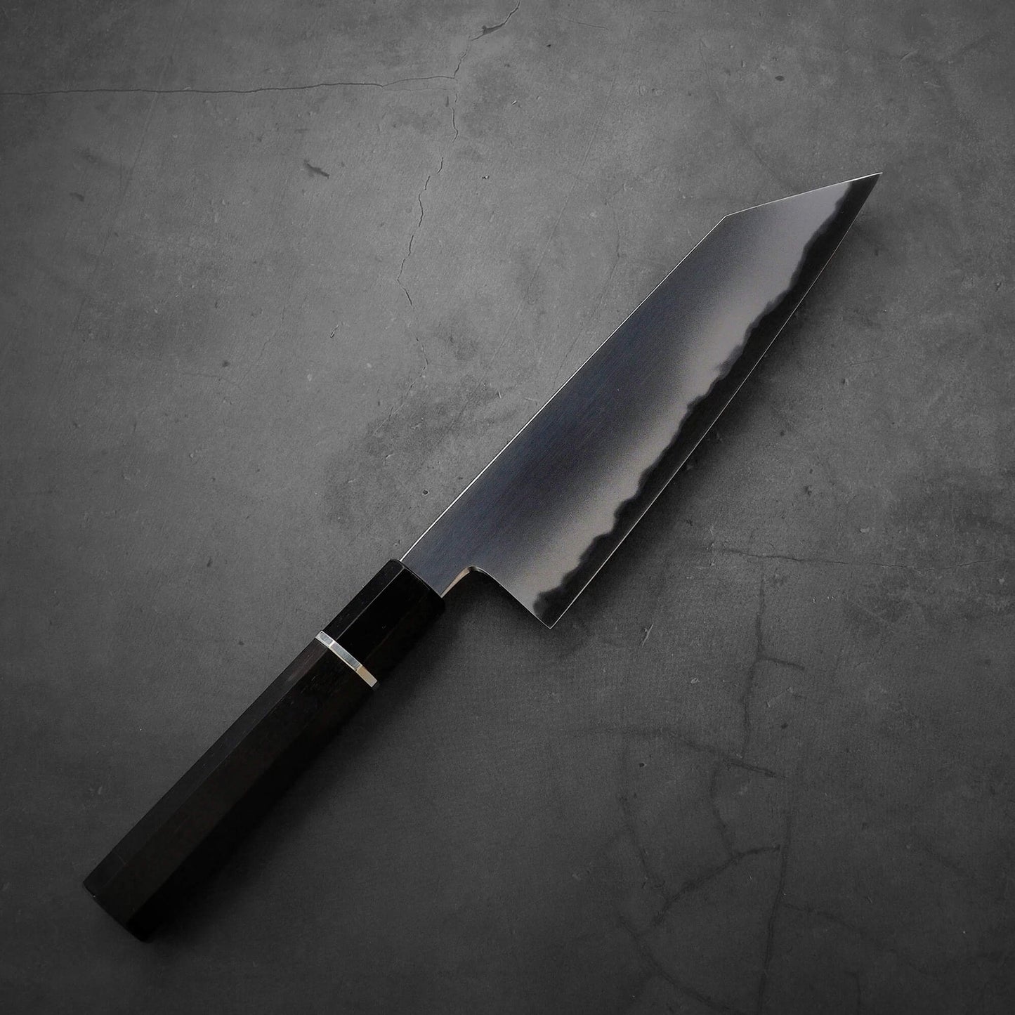 Top down view of Yoshikazu Tanaka AS bunka. This hand-forged Japanese knife is made of aogami super steel.