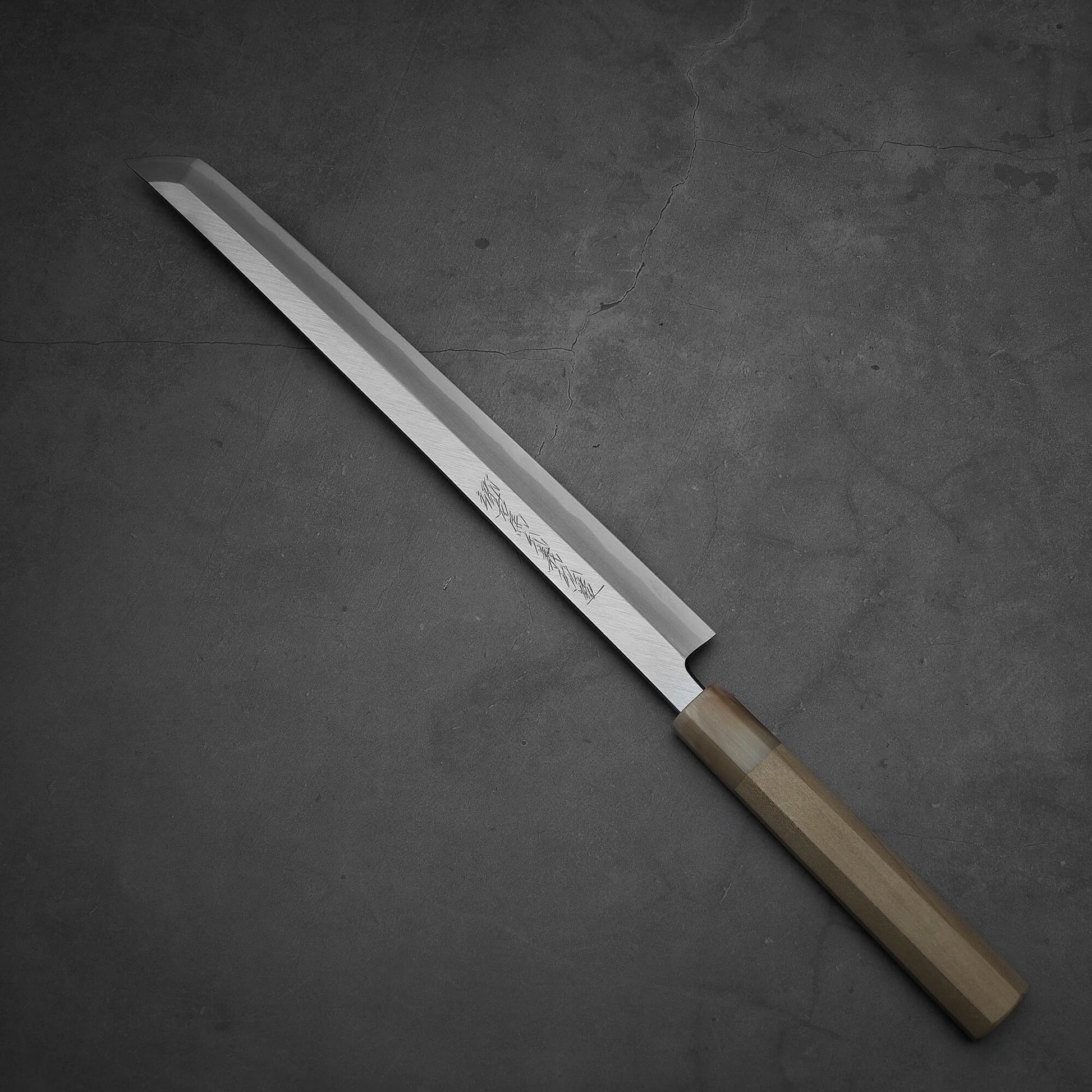 Top down view of Yoshikazu Tanaka 300mm sakimaru takohiki knife with a hand-forged blade made of shirogami#2 steel.