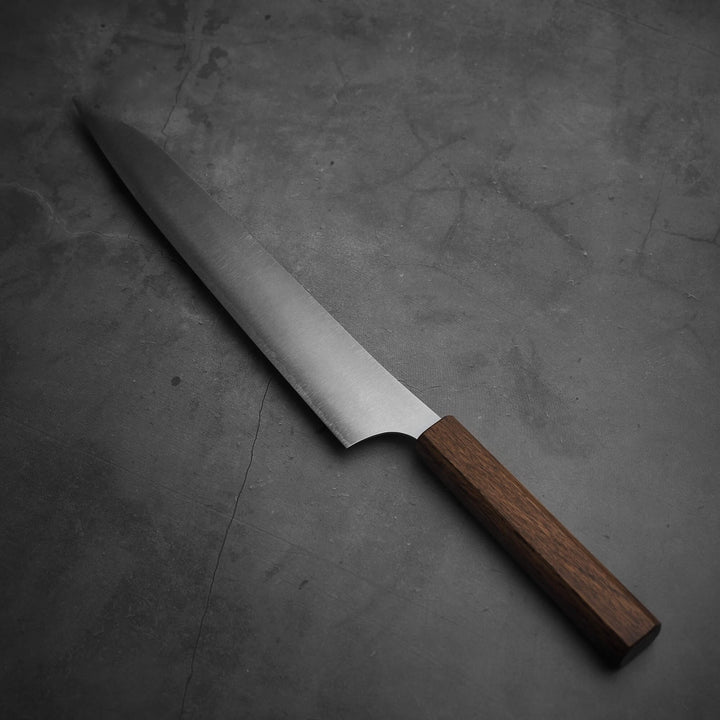 Top view of Yu Kurosaki HAP40 Gekko kiritsuke sujihiki 270mm. Tip is facing upper left. 