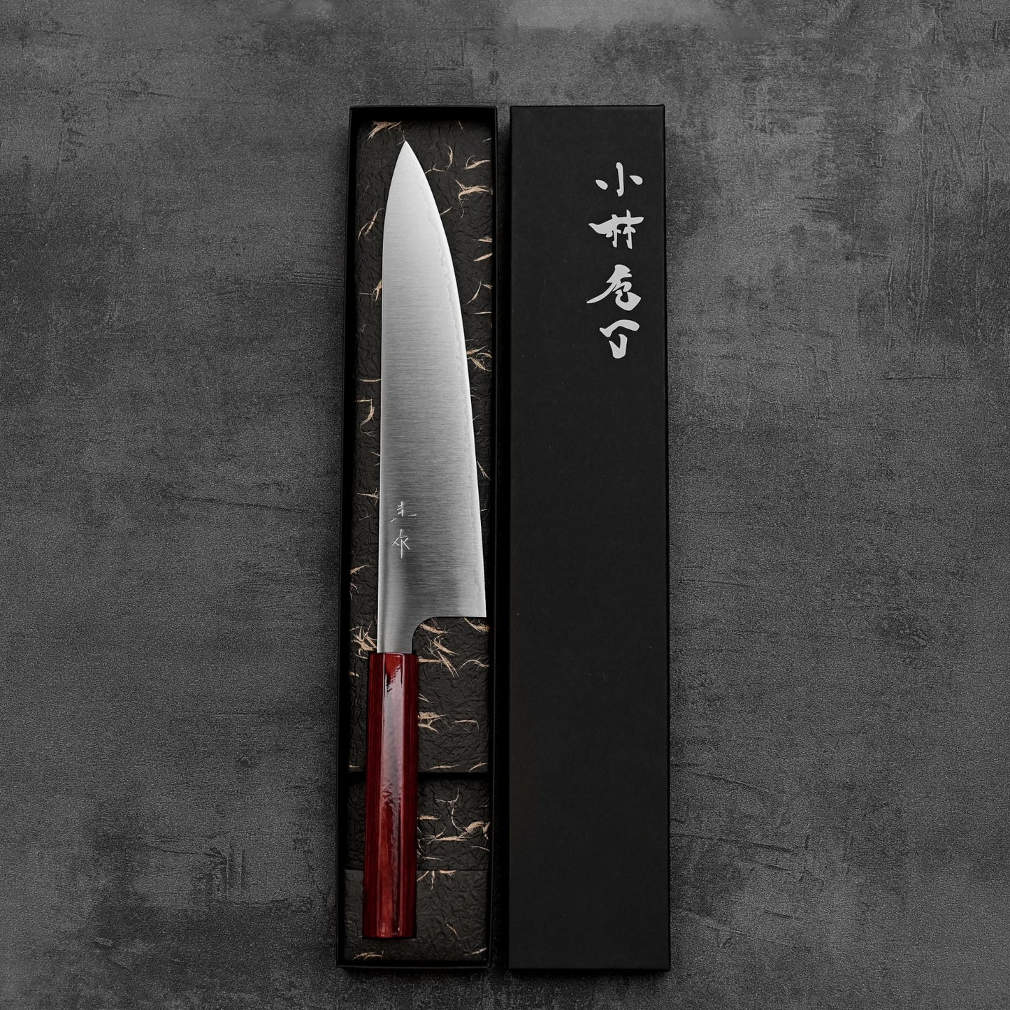 Top down view of Kei Kobayashi SG2 gyuto knife in its box