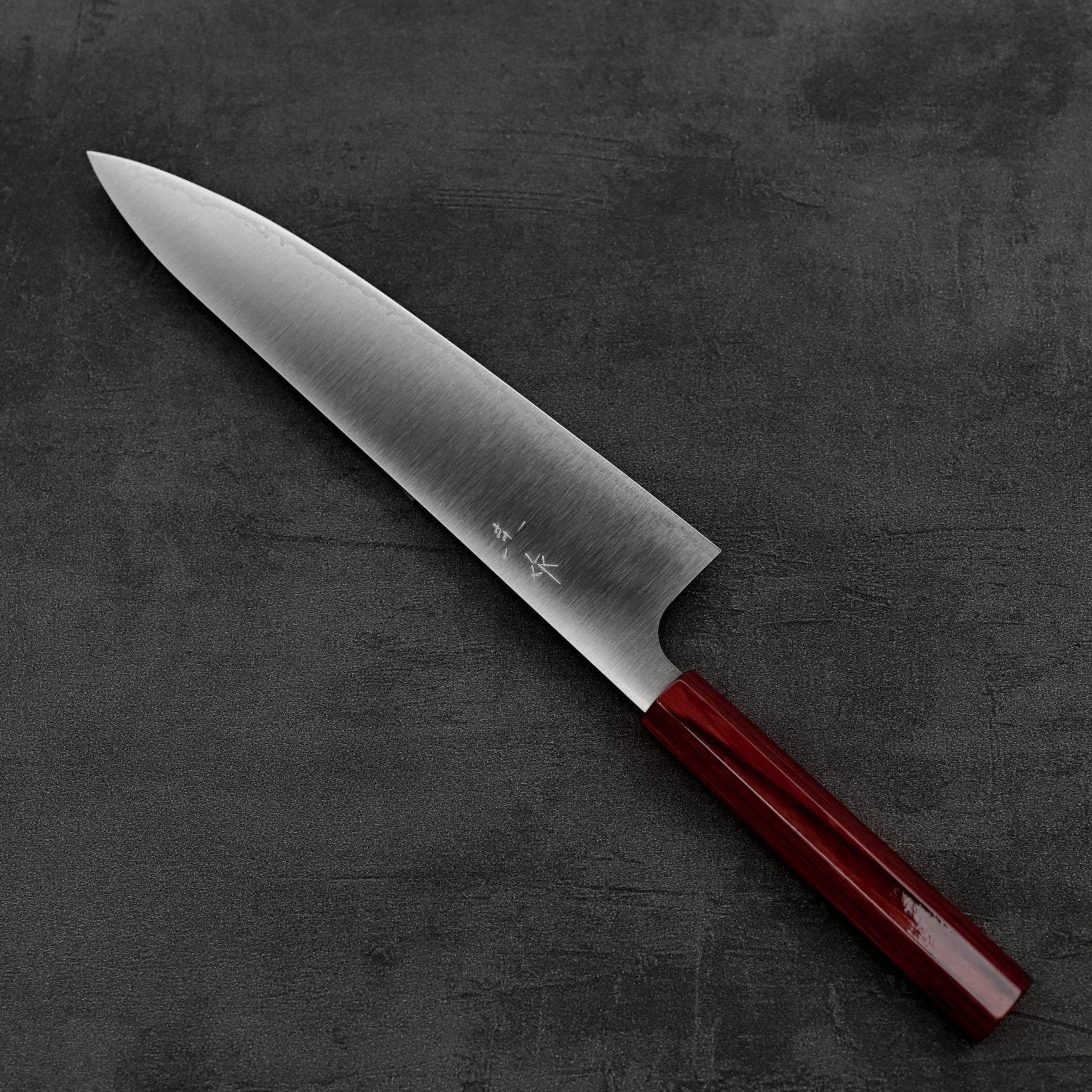 Top down view of Kei Kobayashi SG2 gyuto knife in diagonal position
