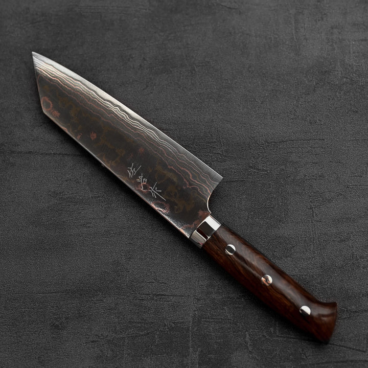 Top down view of Takeshi Saji rainbow damascus aogami#2 bunka knife in diagonal position