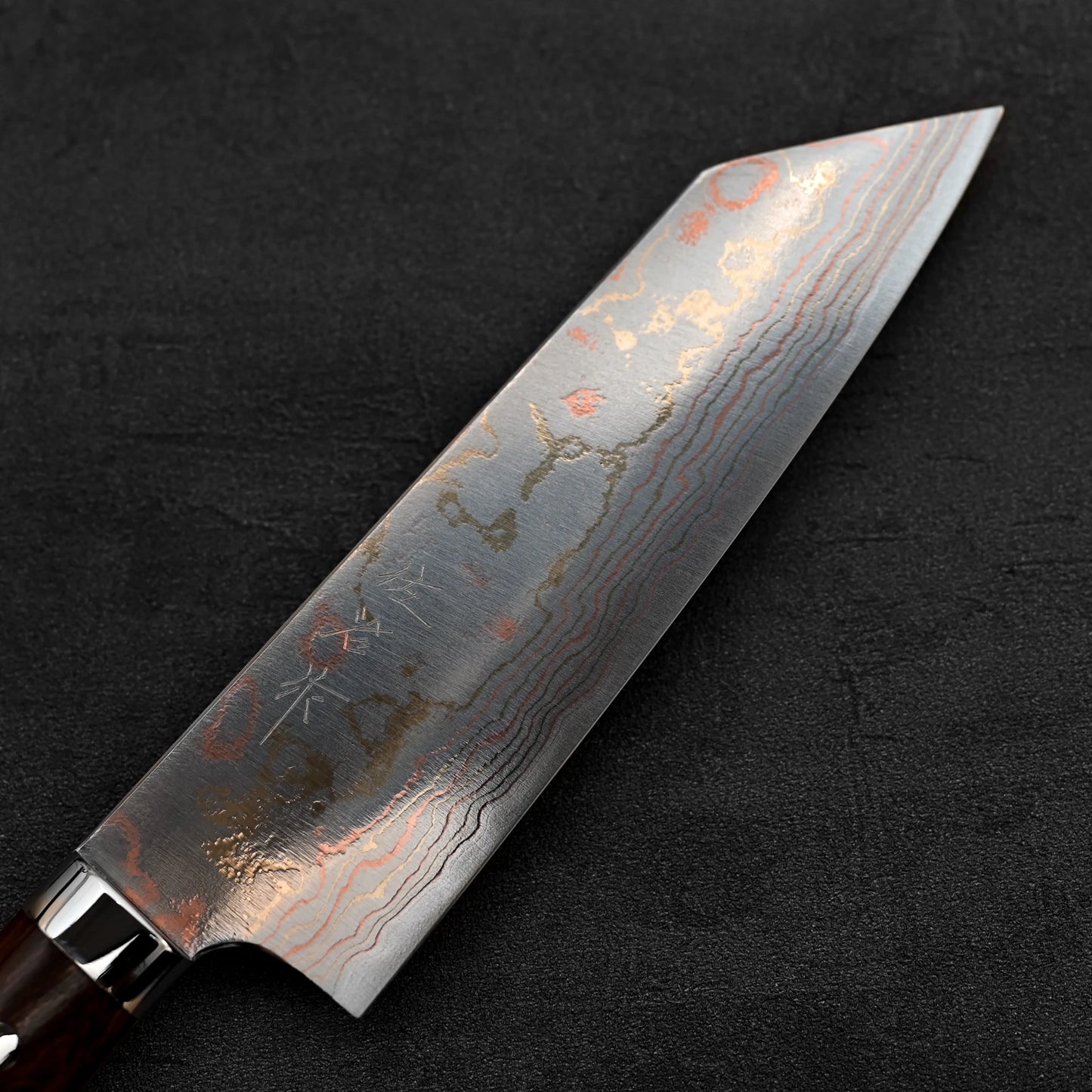 Close up view of the blade of Takeshi Saji rainbow damascus aogami#2 bunka knife