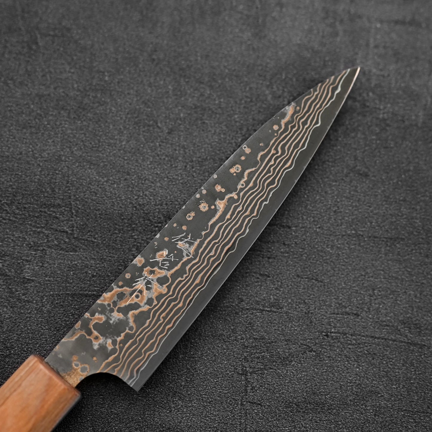 Close up of the blade of Takeshi Saji VG10 Gold damascus petty knife