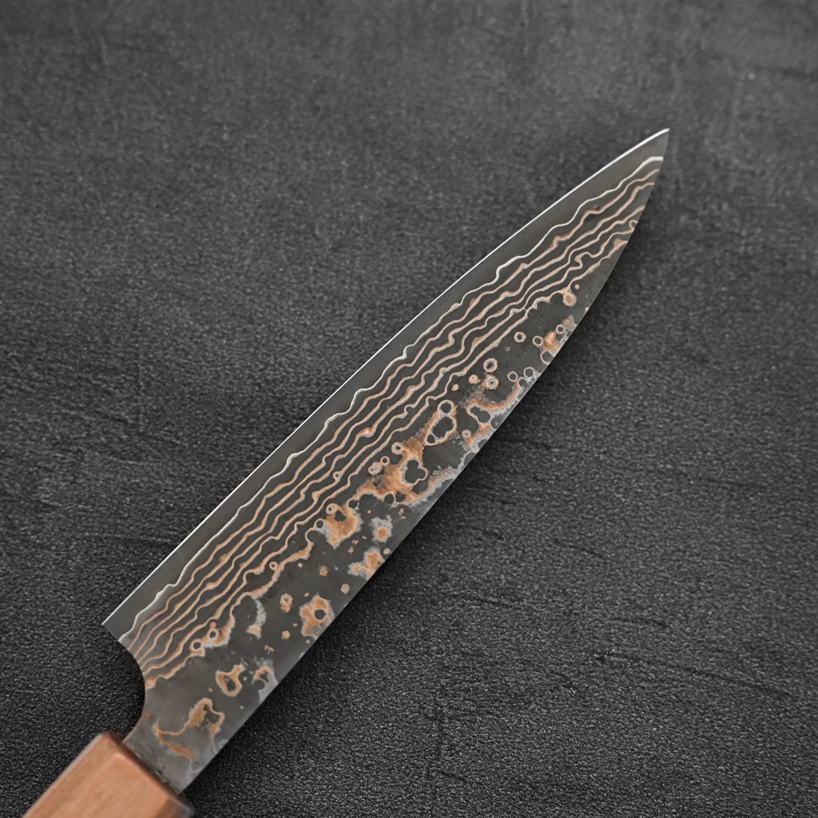 Back side of the blade of Takeshi Saji VG10 Gold damascus petty knife