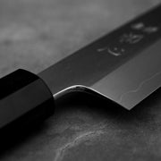 Close up view of the polished choil of Hatsukokoro Nakagawa ginsan kiritsuke gyuto knife