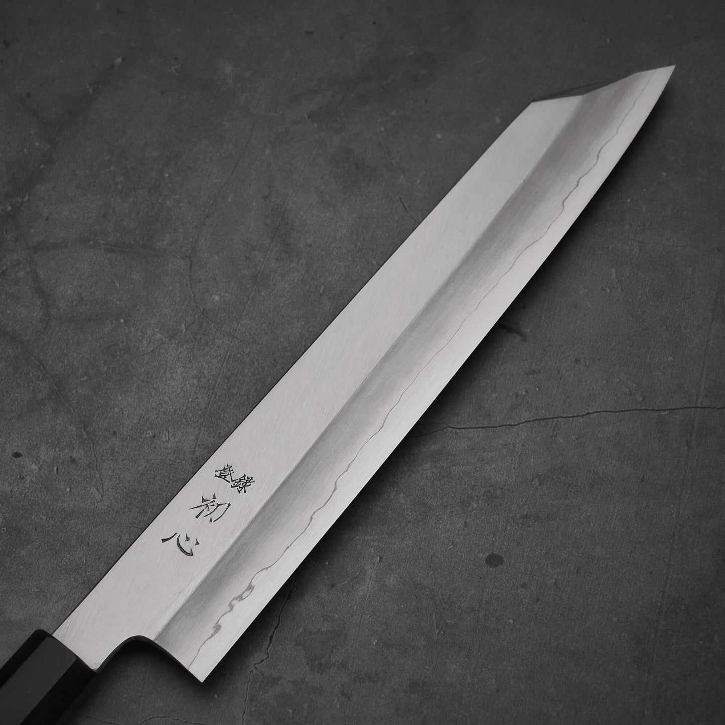 Close up view of the blade of Hatsukokoro Nakagawa ginsan kiritsuke gyuto knife. Image shows right side