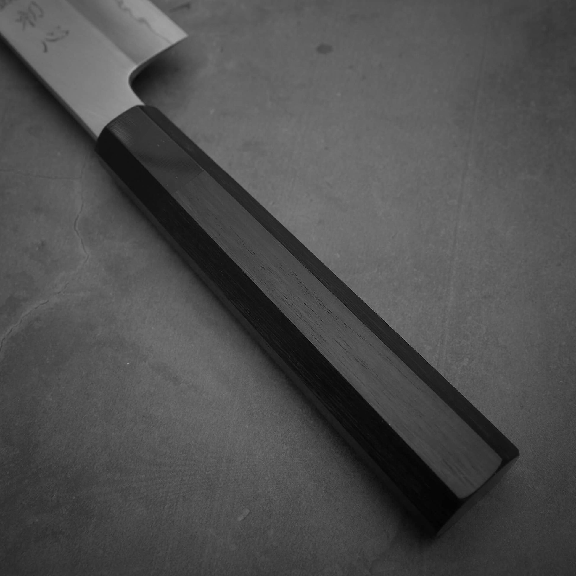 Close up view of the handle of Hatsukokoro Nakagawa ginsan kiritsuke gyuto knife