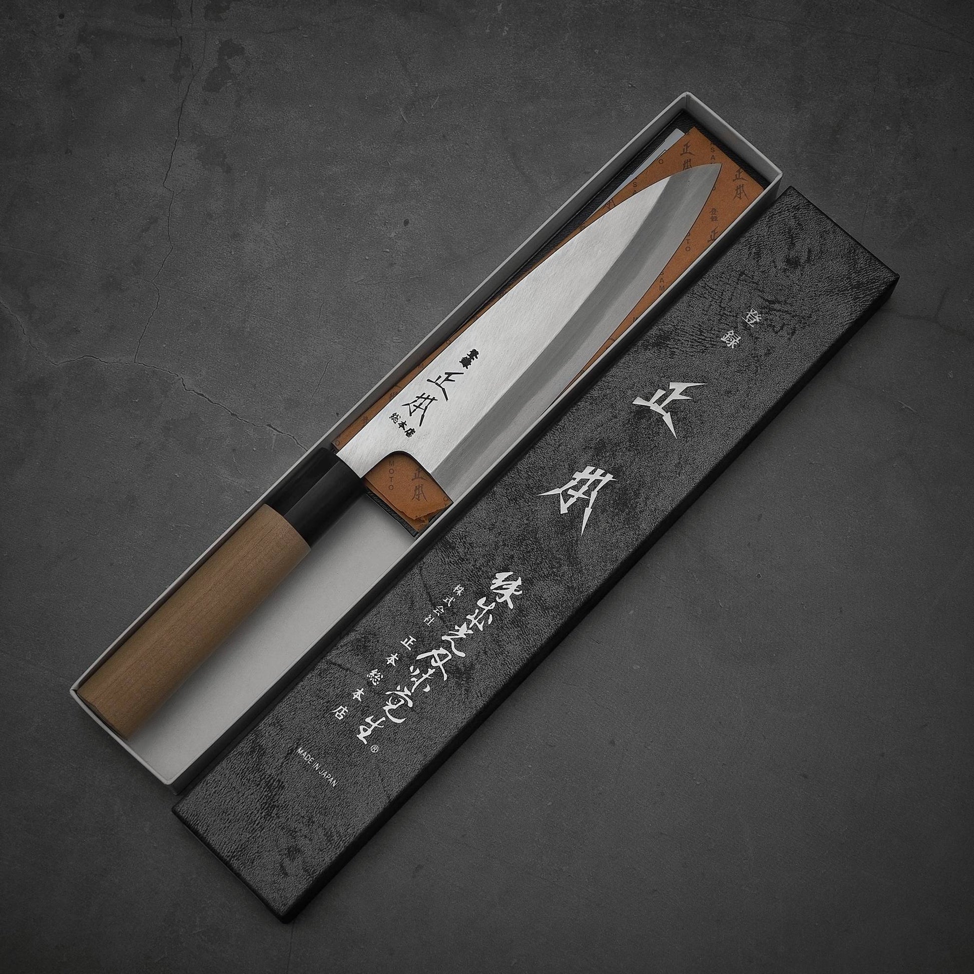 Top view of Masamoto KS shirogami#2 ai-deba knife in its box