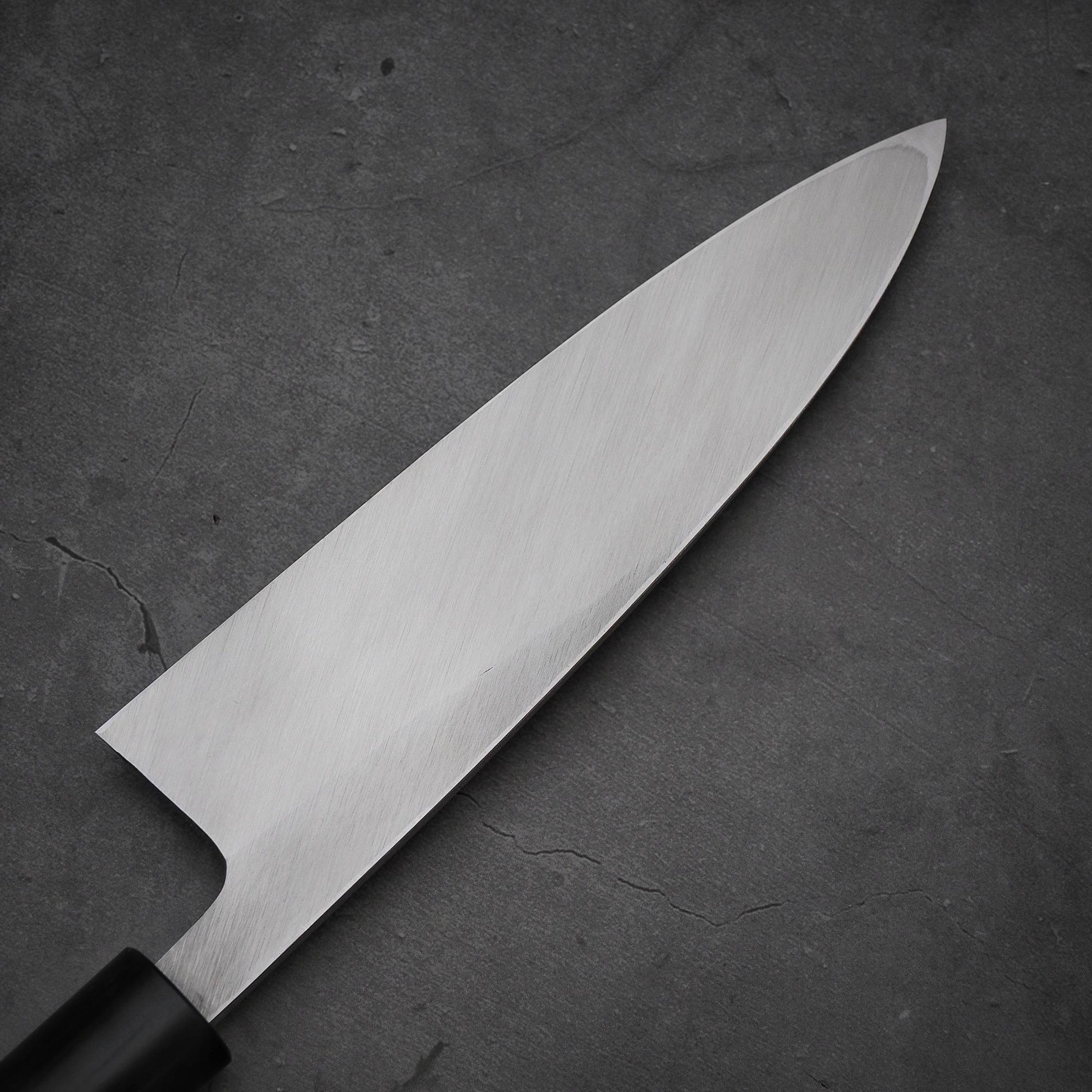 Close up view of the blade of Masamoto KS shirogami#2 ai-deba knife. Image shows the back side