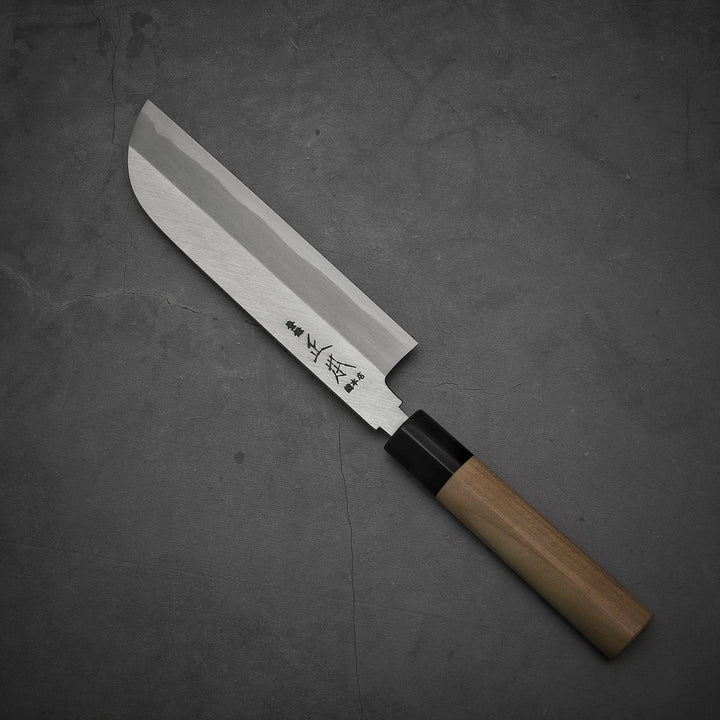 Top view of Masamoto KS shirogami#2 kamagata usuba knife where pointed top is facing towards upper left