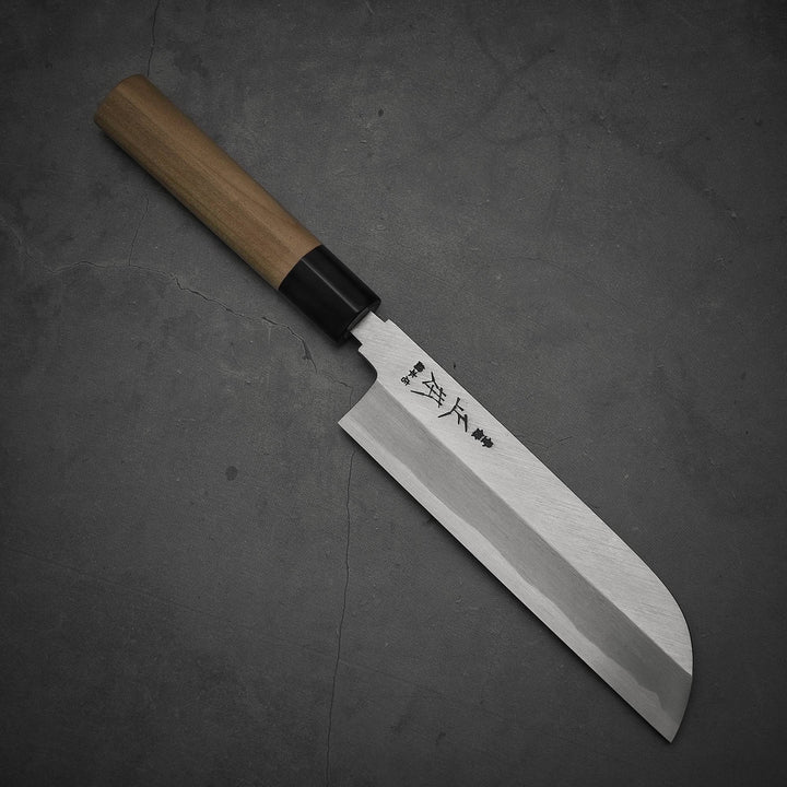 Top view of Masamoto KS shirogami#2 kamagata usuba knife where pointed tip is facing towards lower right