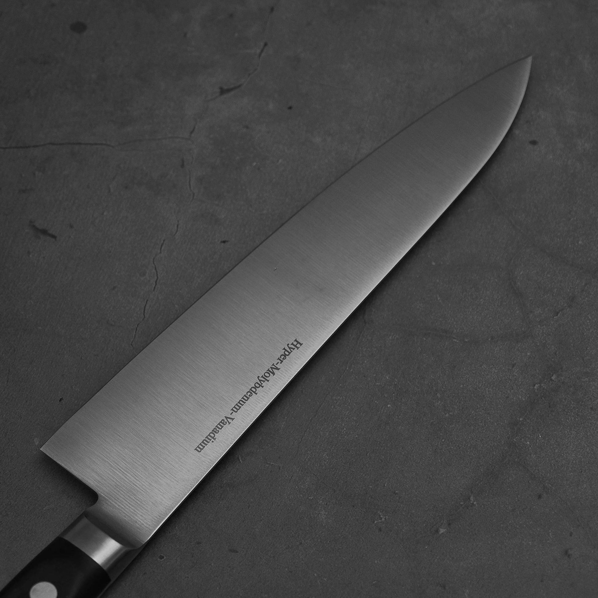Close up view of the blade of Masamoto VG yo-gyuto knife. Image shows left side of the blade