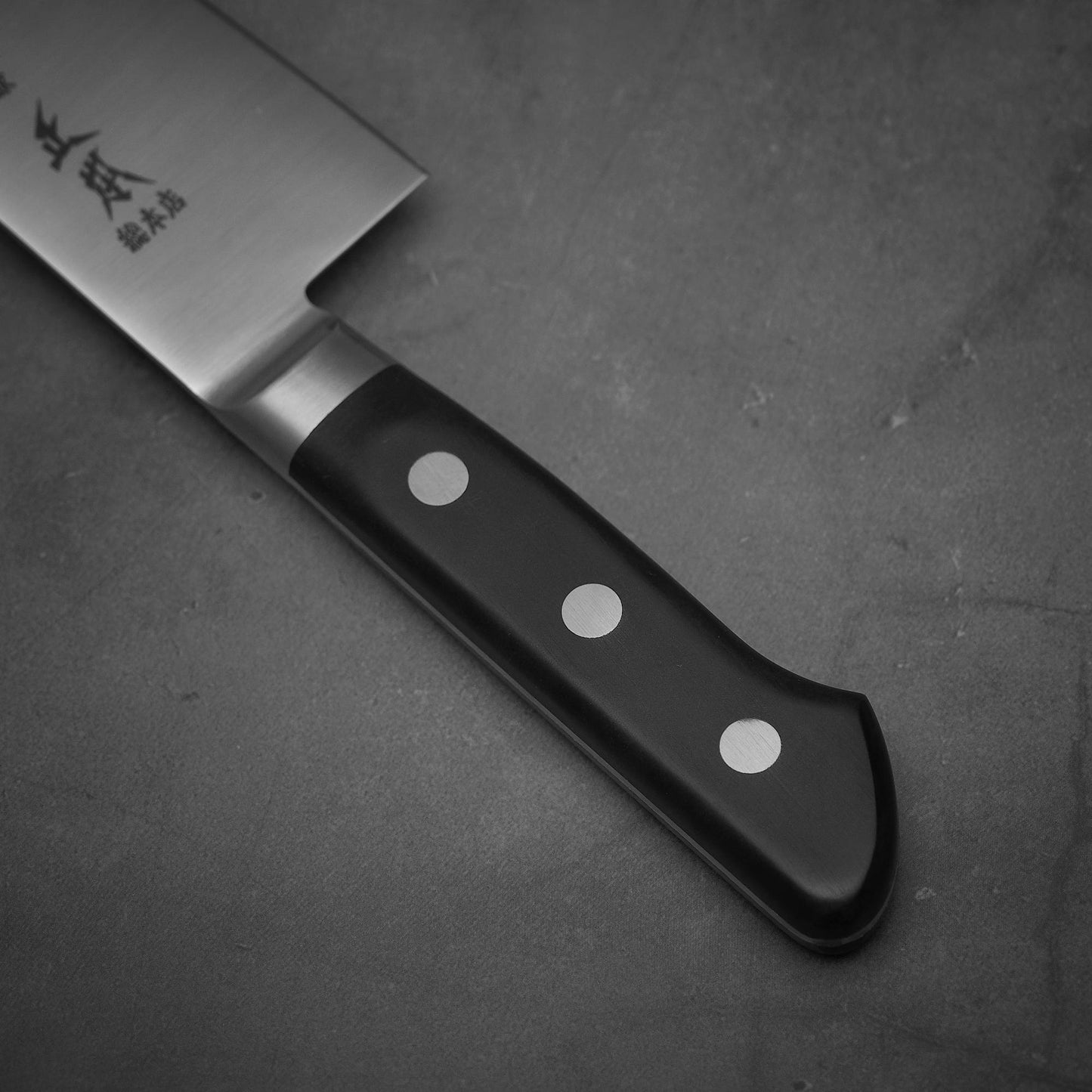 Close up view of the handle of Masamoto VG yo-gyuto knife